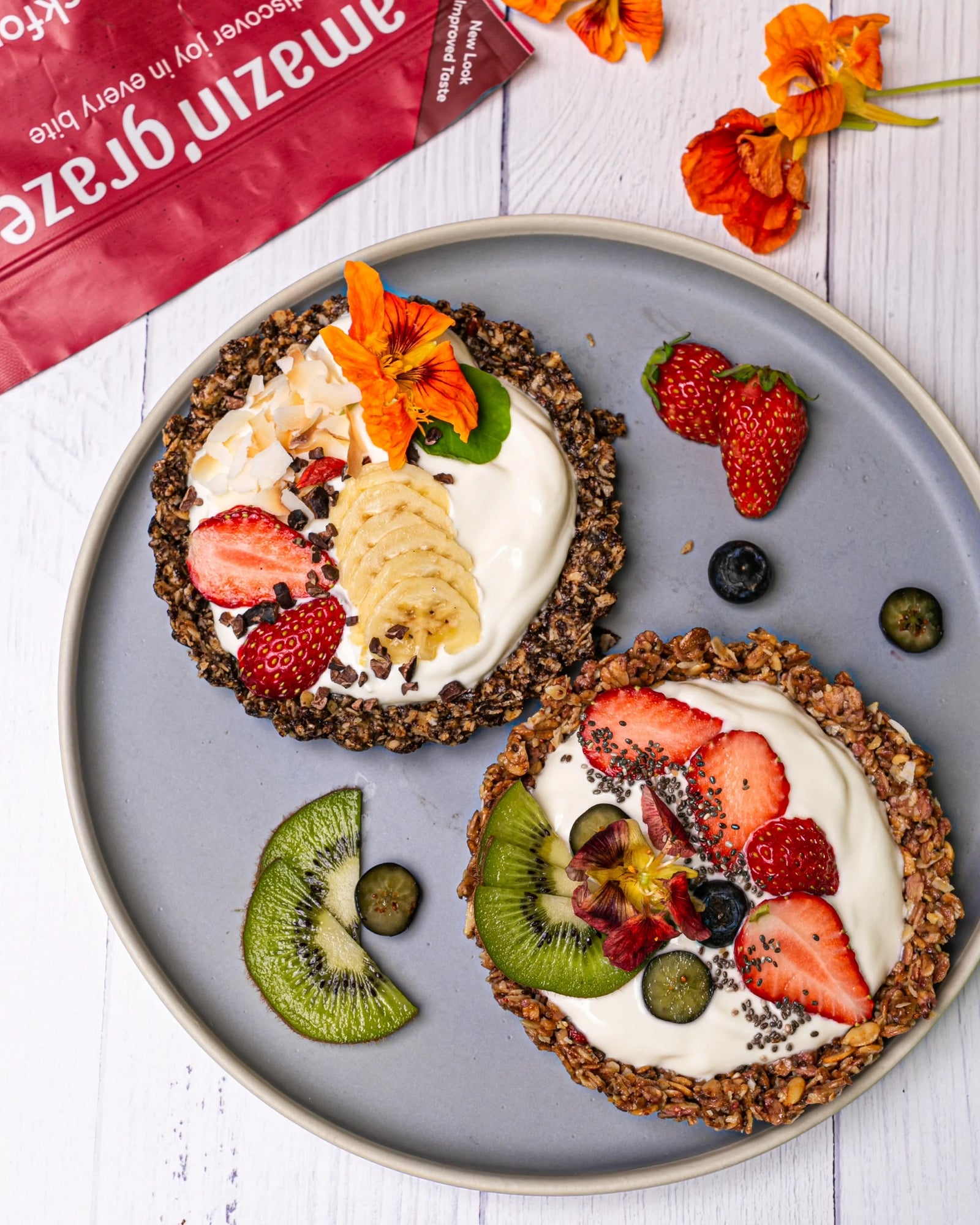 Amazin’ Graze granola breakfast tarts topped with yogurt, bananas, berries, kiwi, and chia seeds.