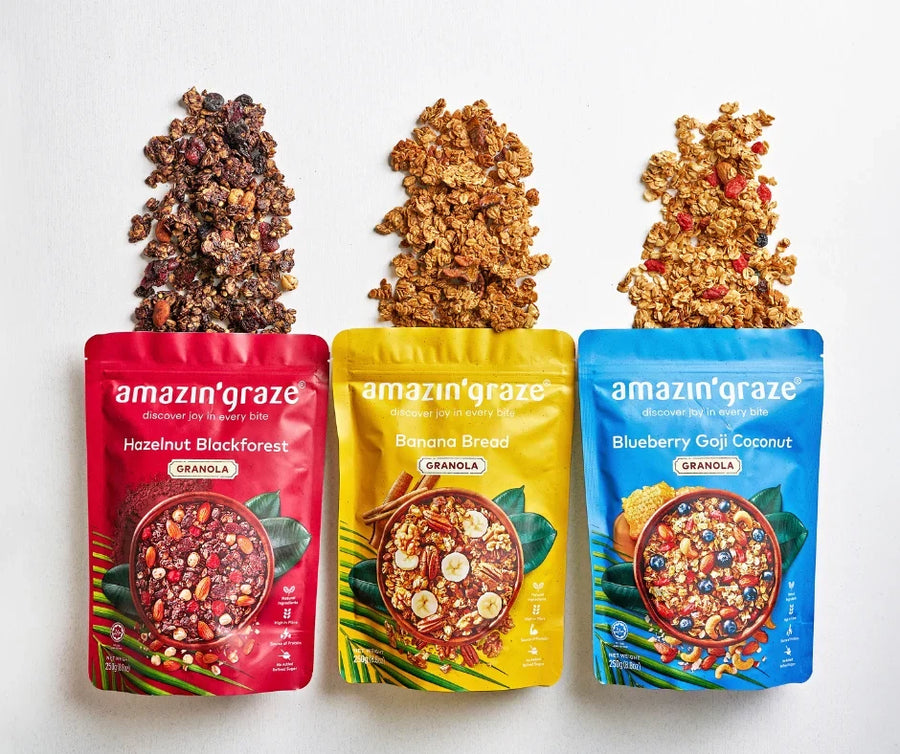Three colorful Amazin’ Graze granola pouches displayed with their handcrafted granola blends.